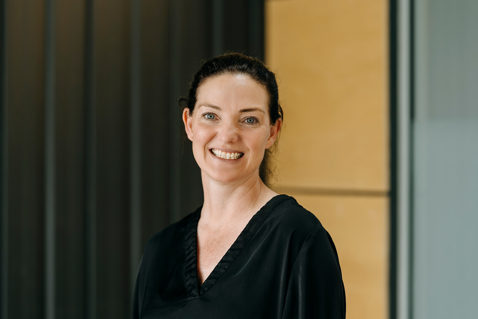 Image of structural engineer Deborah Curd in black top inside the office