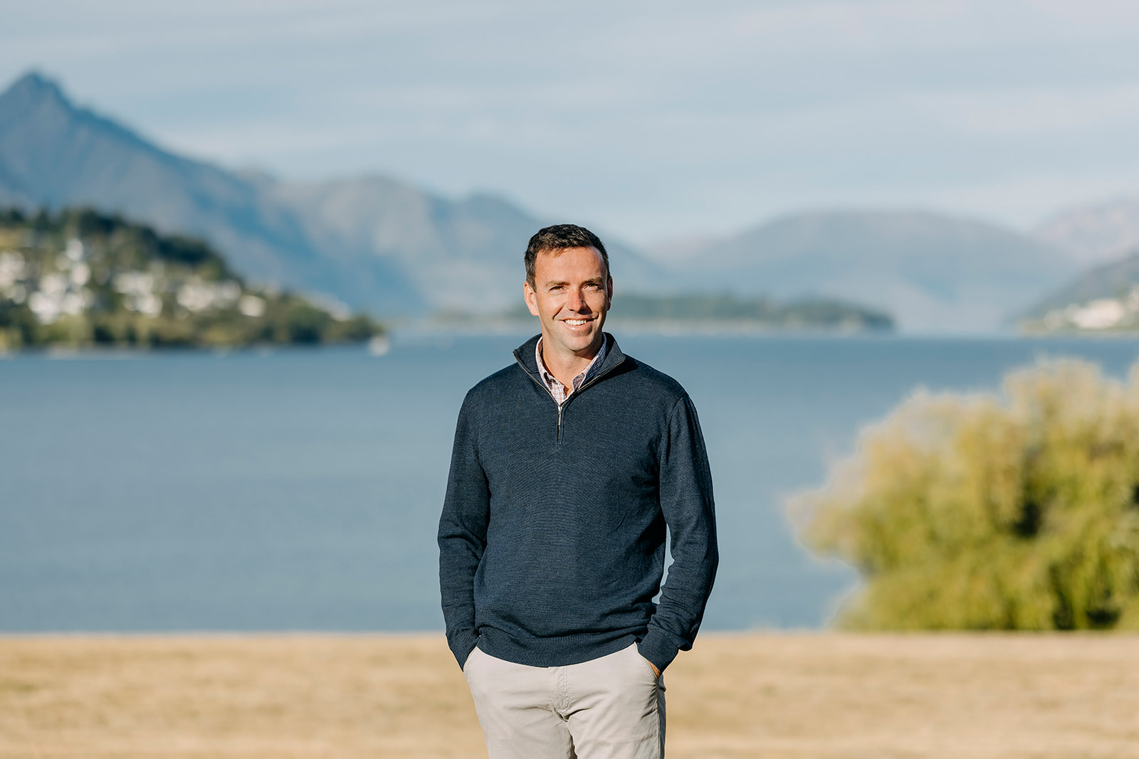 Image of Ollie, Regional Manager at Kirk Roberts, standing by Lake in Queenstown