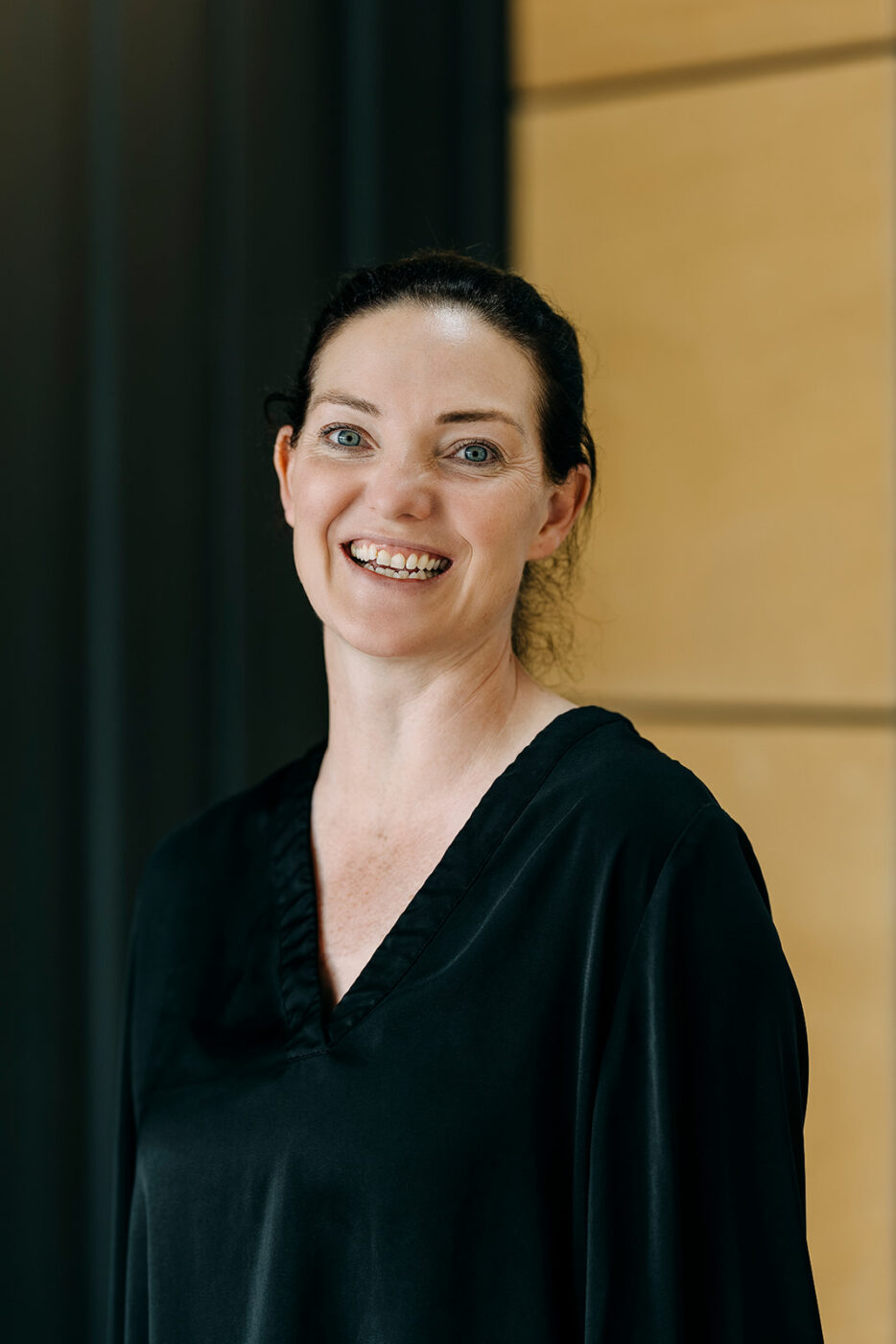 Image of woman smiling in office